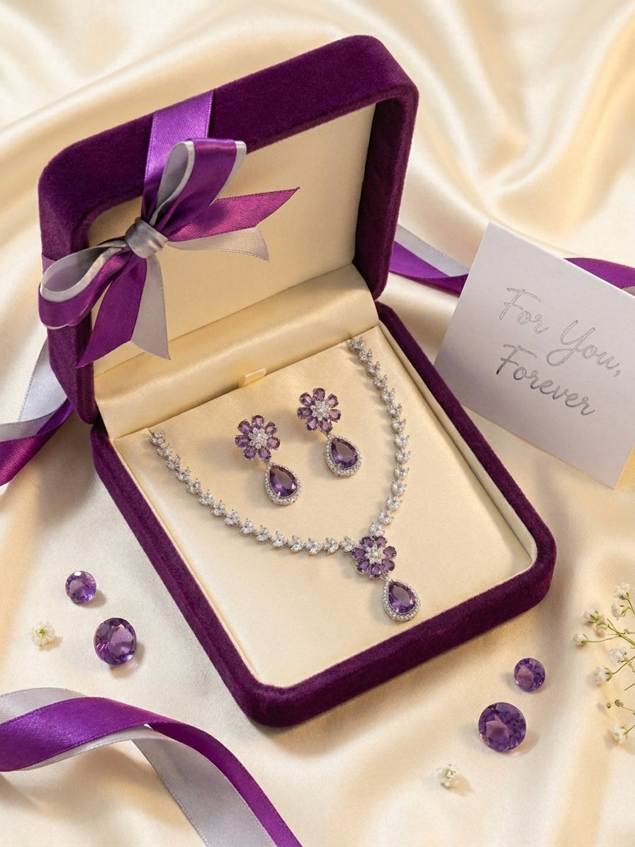 Close-up of amethyst purple CZ flower cluster pendant necklace with marquise white CZ leaf chain on black velvet – luxury bridal jewelry AureliaBlends