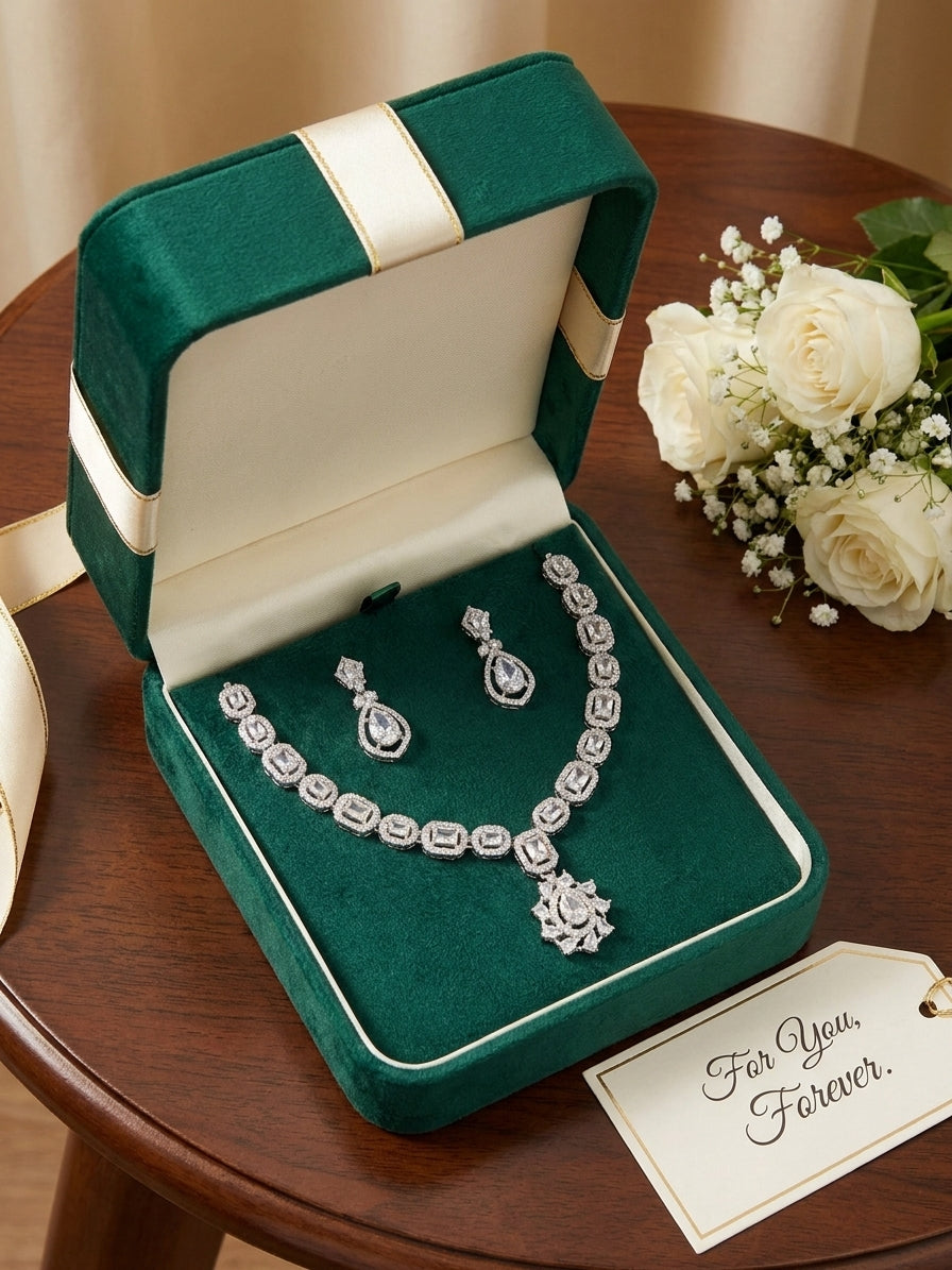 Silver CZ bridal necklace and teardrop earring set on black velvet background – AureliaBlends statement wedding jewelry