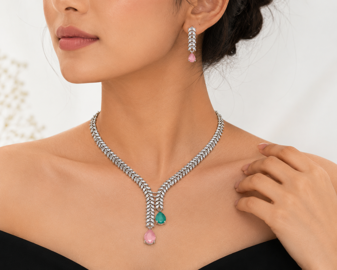 Pink and green CZ wheat chain necklace and earring set flat lay on ivory satin with roses and gold frame – AureliaBlends statement jewelry