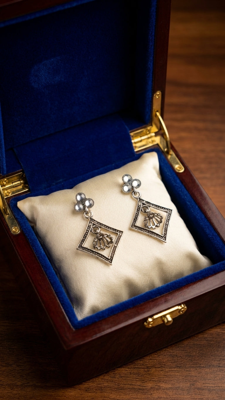 Oxidised silver pearl trefoil and diamond frame jhumka drop earrings in open navy blue velvet gift box with For You card on wooden surface – AureliaBlends luxury ethnic earrings