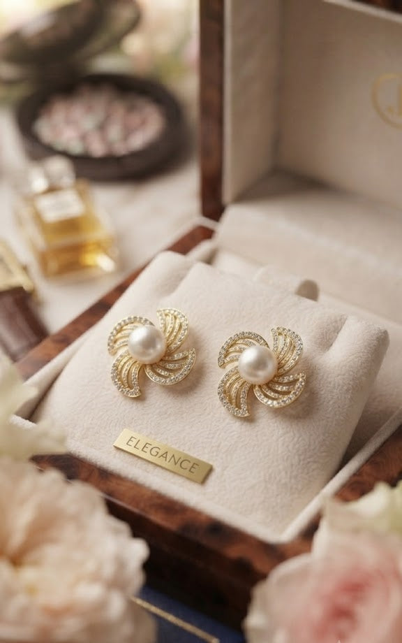 Gold pavé CZ swirl floral pearl stud earrings on a white jewellery card on black velvet background – AureliaBlends Elegance Collection product shot