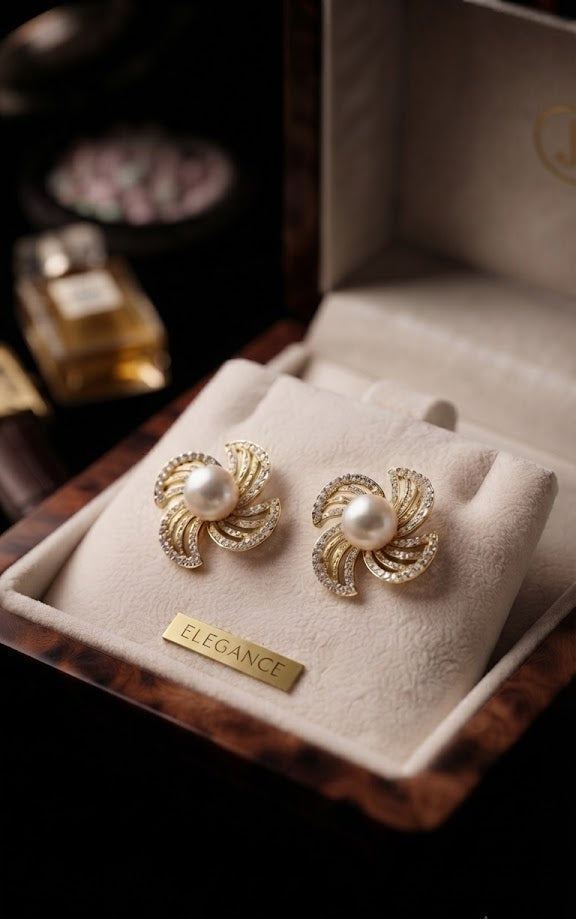 Gold pavé CZ swirl floral pearl stud earrings in an open navy blue jewellery box with gold satin ribbon on black velvet – AureliaBlends gift jewellery