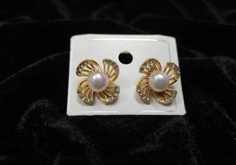 Gold pavé CZ swirl floral pearl stud earrings displayed in a luxury cream velvet jewellery box with gold monogram lid on a dark wood surface – AureliaBlends Elegance Collection