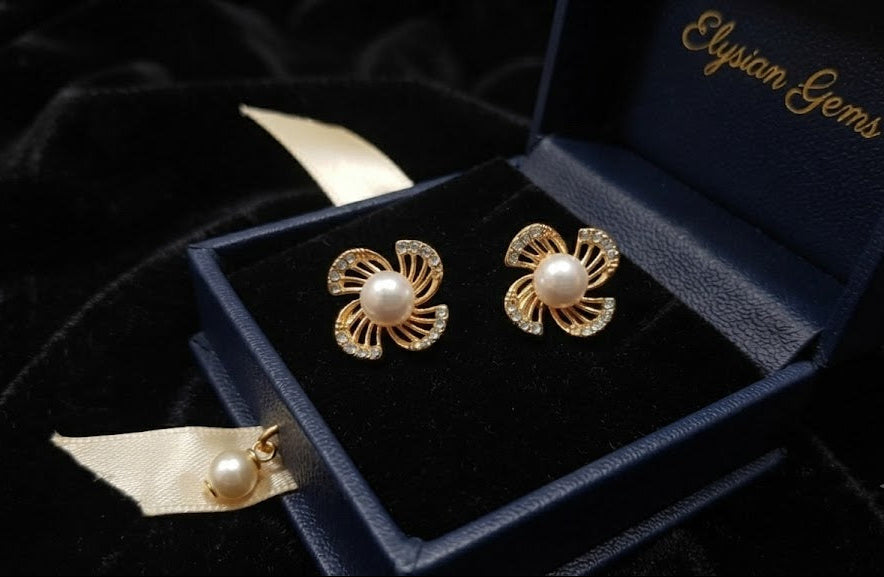 Gold pavé CZ swirl floral pearl stud earrings in a cream velvet Elegance jewellery box with blush roses and perfume – AureliaBlends bridal earrings gift