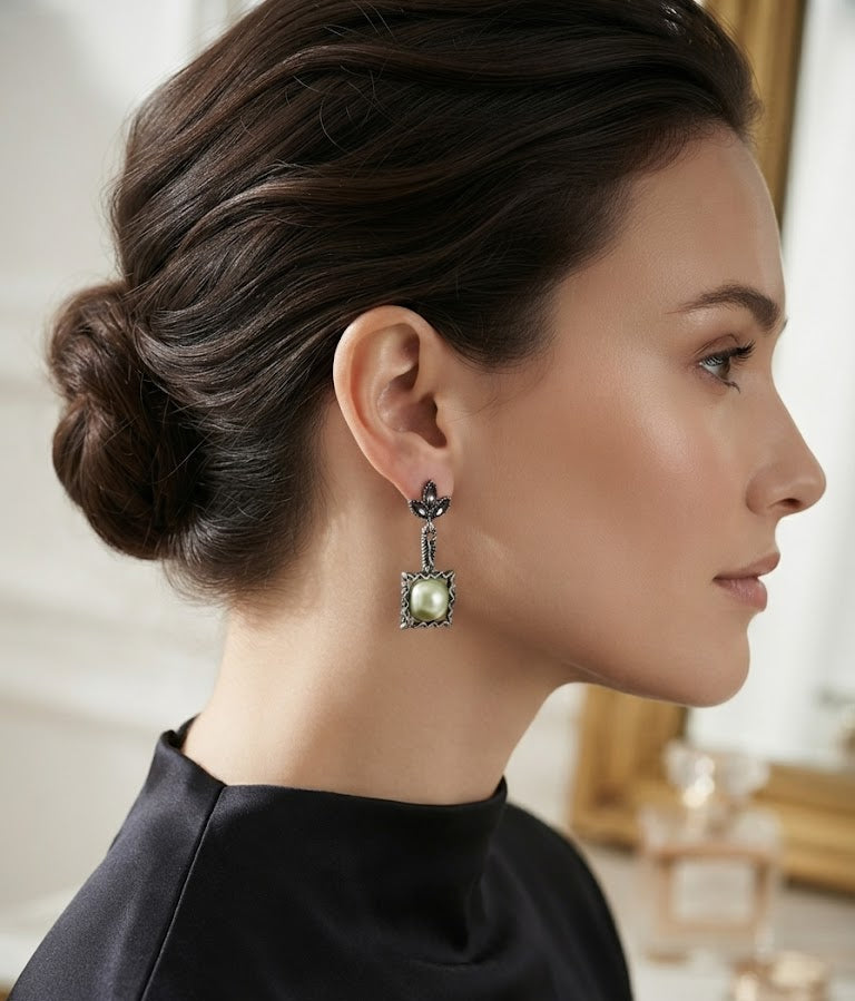 Oxidised silver marcasite leaf and square sky blue pearl drop earrings flat lay on cream damask silk with gold perfume bottle, fountain pen, walnut jewellery box and lavender sprigs – AureliaBlends