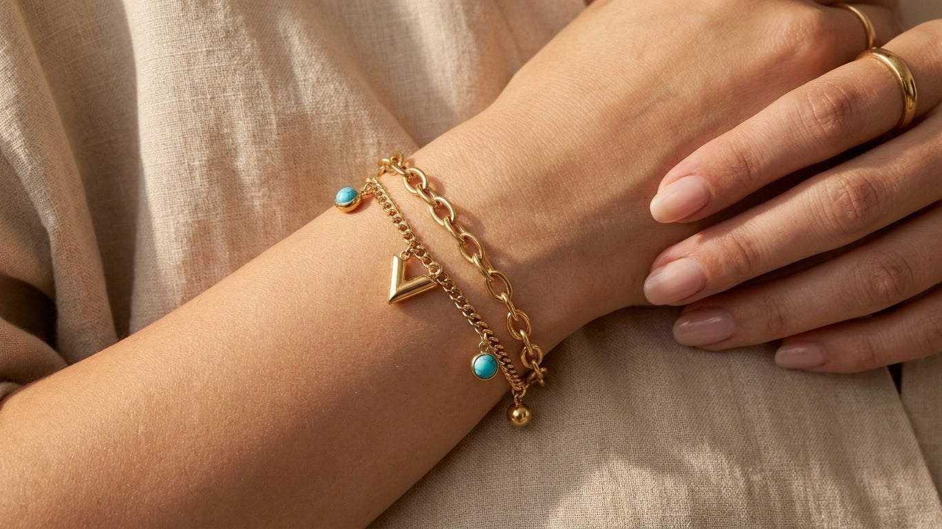 Gold double layer turquoise stone bezel and chevron charm bracelet anklet flat lay on cream silk with turquoise stones eucalyptus and gold tray – AureliaBlends