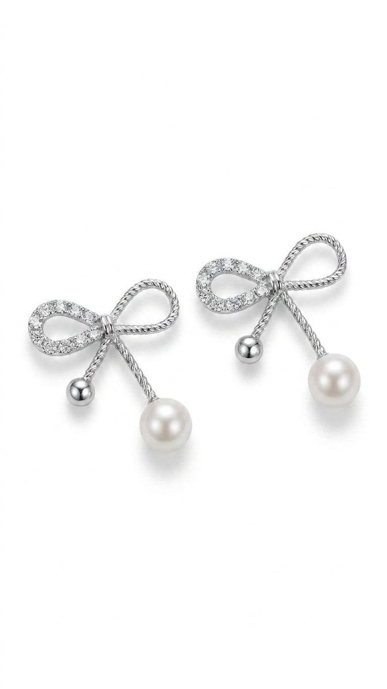 Silver CZ twisted rope bow pearl drop earrings on white background – AureliaBlends dainty bridal earrings product shot
