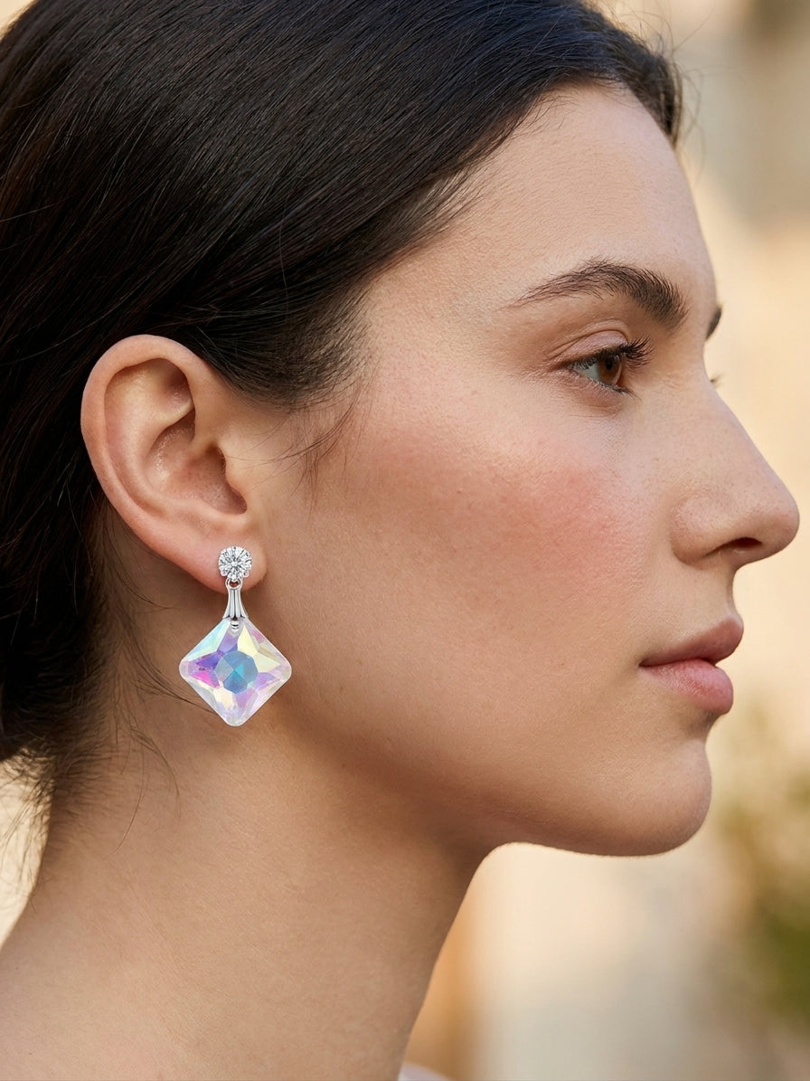 Silver CZ stud and aurora borealis iridescent square crystal drop earrings in open navy blue velvet gift box with cream satin lining and For You gift card on wooden surface with scattered rose petals and white satin ribbon – AureliaBlends luxury gift earrings