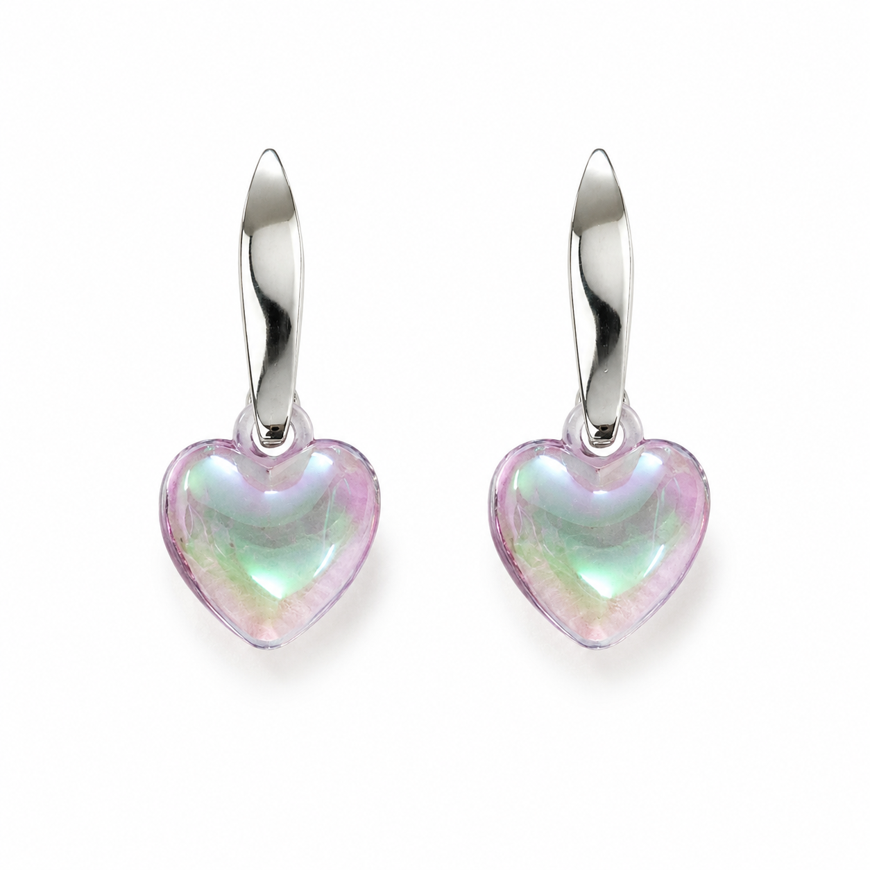 Model with elegant updo wearing silver twisted huggie hoop and puffy iridescent aurora heart crystal drop earrings showing blush pink mint green lavender shimmer against white background – AureliaBlends romantic earrings