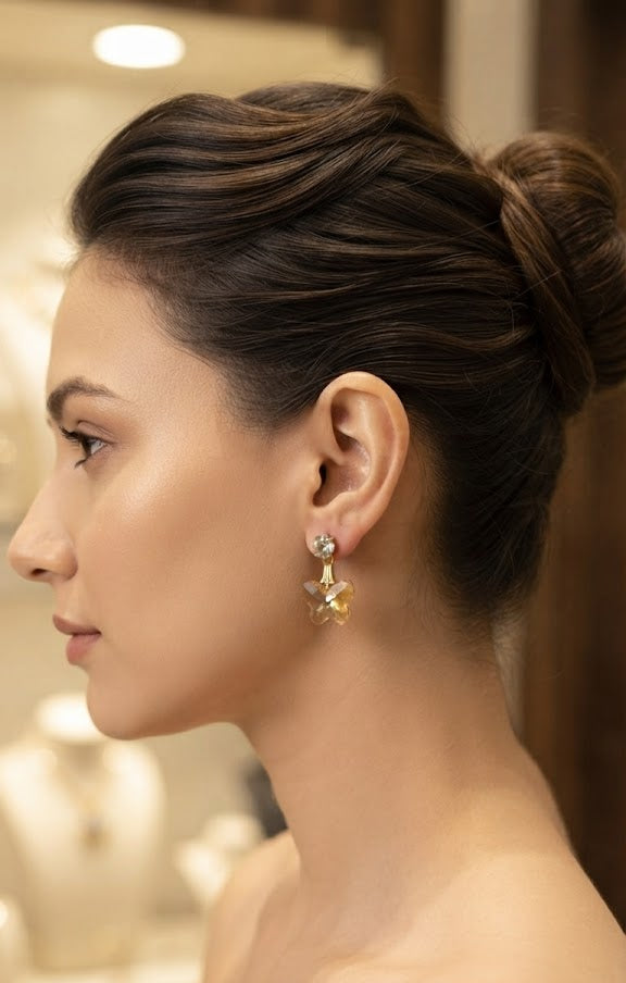 Gold-plated CZ stud and emerald green faceted butterfly crystal drop earrings in open burl walnut wood jewellery box with royal blue velvet lining and gold brass corner accents – AureliaBlends luxury gift earrings