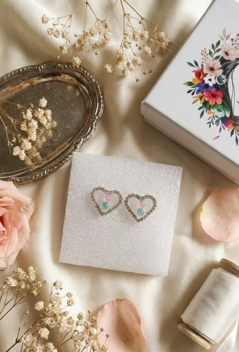 Silver pavé CZ open heart pink and aquamarine stone stud earrings in an open cream gift box with burgundy velvet cushion, pink satin bow and floral gift card on white background – AureliaBlends gift jewellery