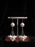 Silver lavender grey pearl cluster chandelier drop earrings flat lay on cream velvet jewellery tray on dark burl wood surface with cream drawstring pouch, loose pearls, pearl necklace, compact mirror and satin ribbon – AureliaBlends Perle de Chandelier lifestyle shot
