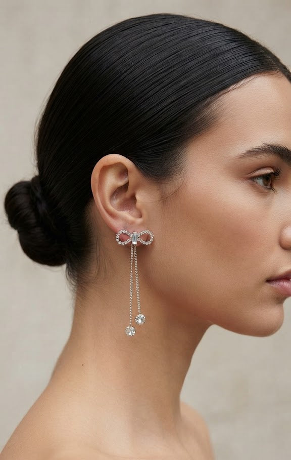 Silver CZ open bow tassel chain drop earrings in an open navy blue velvet gift box with silver satin ribbon on a light grey background – AureliaBlends luxury bridal earrings gift
