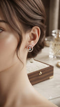 Rose gold pavé CZ open circle halo pink and mint stone stud earrings in an open navy blue velvet gift box with white satin cushion and gold heart card on a wooden surface with dried lavender sprigs – AureliaBlends gift jewellery