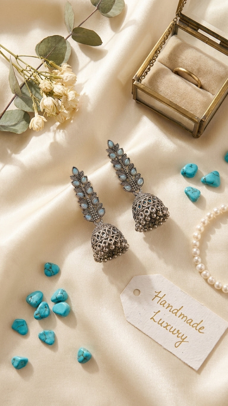 Oxidised silver jhumki earrings close-up with iridescent crystal leaf climber – gift for her AureliaBlends