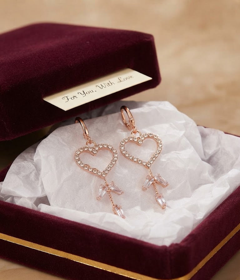 Rose gold pavé CZ open heart baguette crystal tassel leverback drop earrings hanging on a fine wire against a dreamy blush floral background of pink roses, white peonies, hydrangea, lavender and eucalyptus – AureliaBlends romantic bridal earrings garden editorial