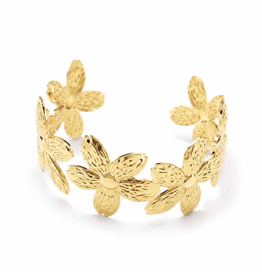 Gold floral cuff bracelet with five textured daisy flowers on pink rose background – AureliaBlends statement bangle