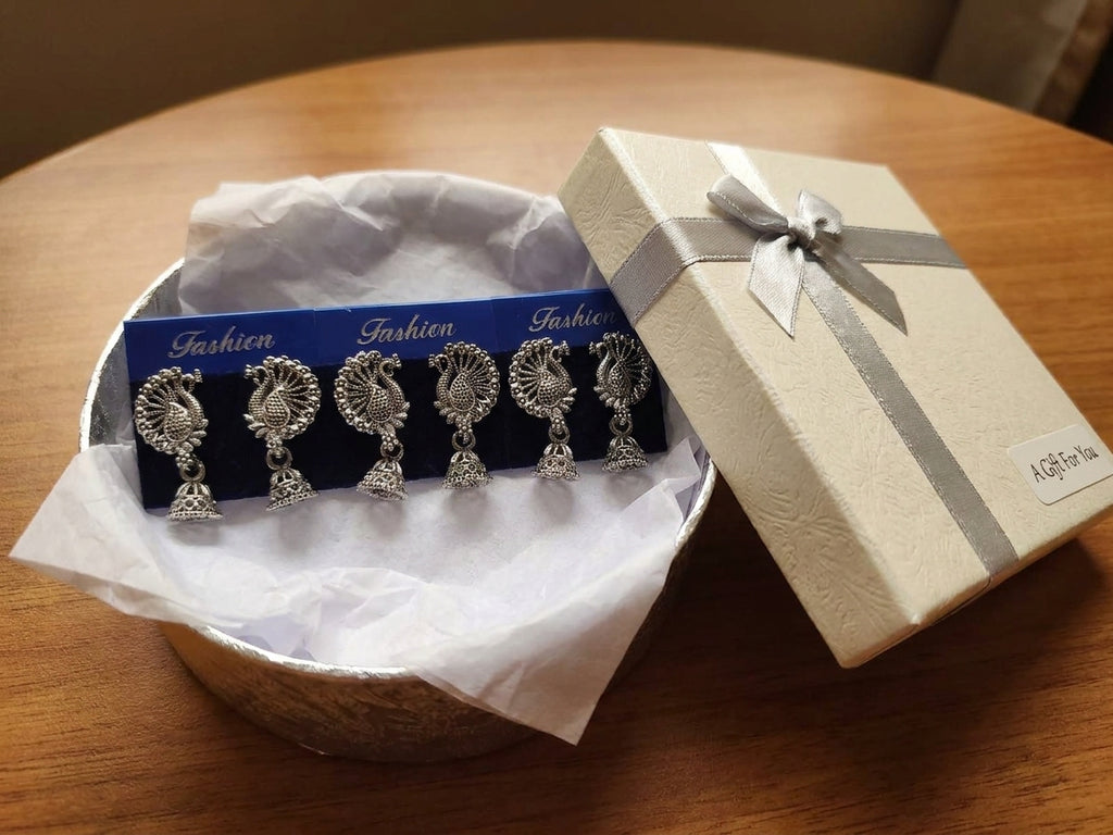 Oxidized silver peacock jhumka earrings lifestyle flat lay with jewelry box and accessories – gift for her AureliaBlends