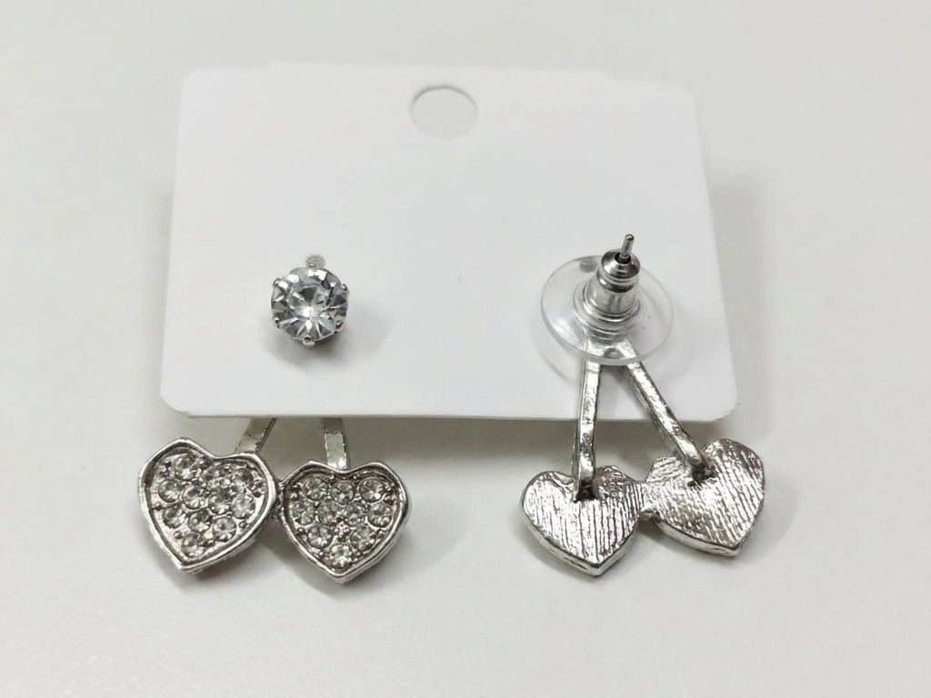 Silver CZ double heart ear jacket earrings displayed on a jewellery card in an open cream velvet gold-trim gift box on gold satin with baby's breath – AureliaBlends