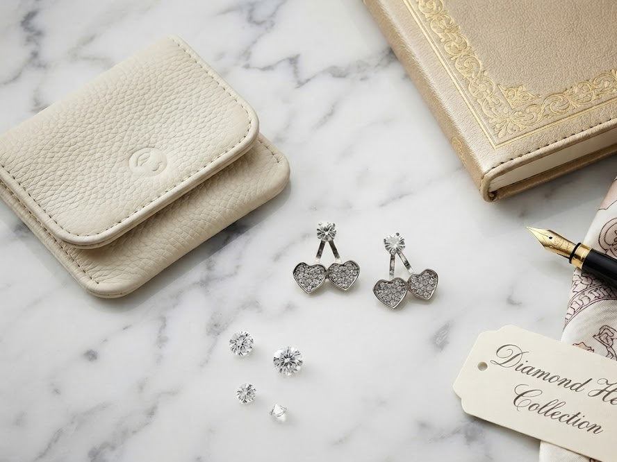 Silver pavé CZ double heart ear jacket earrings in an open navy blue velvet jewellery box – AureliaBlends luxury bridal earrings